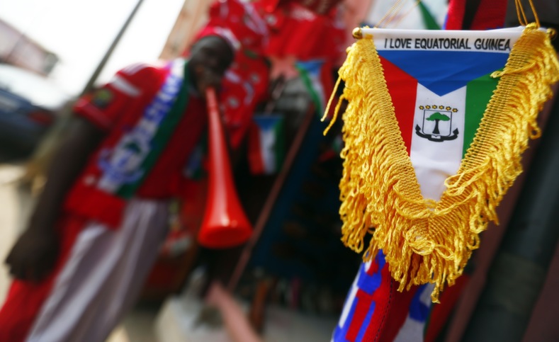 A man looks on at his shop with national flags and jerseys for Equatorial Guinea which will host the opening ceremony of African Cup of Nations on Saturday, in Bata Jan. 16, 2015.