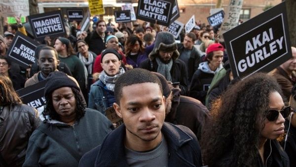 Protesters demand justice for Akai Gurley in a march toward New York Police Department's 75th Precinct from the site of his shooting death in Brooklyn, Dec. 27, 2014.