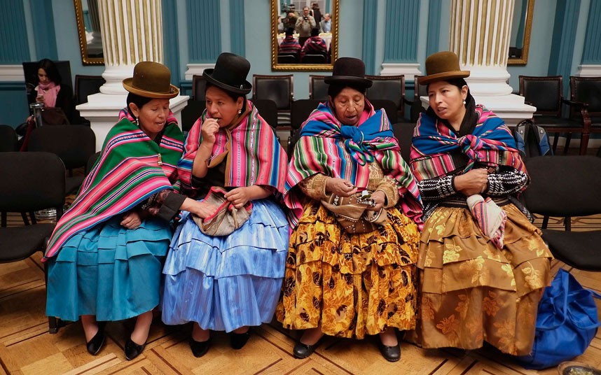 Bolivian women attend a ceremony at the foreign ministry hall during All Saints' Day in La Paz