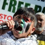 Jollene Levid speaks at 2014 Palestine solidarity rally. Palestinian resistance is a source of inspiration for her own feminist struggle.