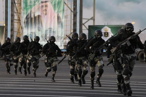 Members of the Saudi security forces take part in a military parade in preparation for the annual Haj pilgrimage in the holy city of Mecca September 28, 2014.