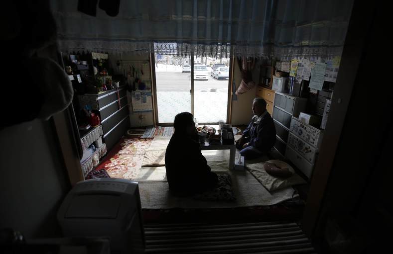 Tomoko Hoshino, 78, and her husband Akira (R), 79, who were evacuated from Okuma, a town inside the exclusion zone next to Tokyo Electric Power Co's (TEPCO) tsunami-crippled Fukushima Daiichi nuclear power plant, talk at their house in a temporary housing complex in Aizuwakamatsu, Fukushima prefecture, Feb. 17, 2015.