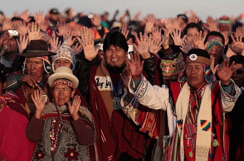 Bolivia’s President Evo Morales (center) celebrates the sunrise during a winter solstice ceremony in Tiwanaku, on June 21, 2011.