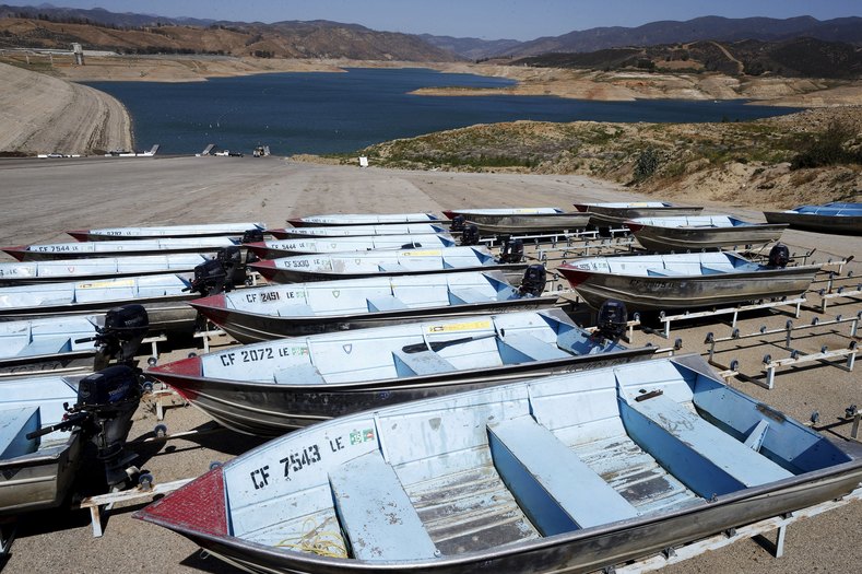 Boats sit at the former high water mark at Castaic Lake reservoir in Castaic, California April 15, 2015.