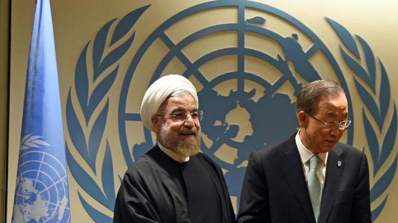 UN Secretary-General Ban Ki-moon (R) greets Iranian President Hassan Rouhani before a meeting at the United Nations in New York on September 23, 2014.