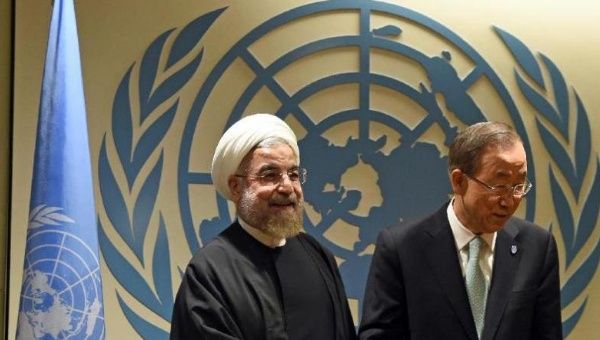 UN Secretary-General Ban Ki-moon (R) greets Iranian President Hassan Rouhani before a meeting at the United Nations in New York on September 23, 2014.