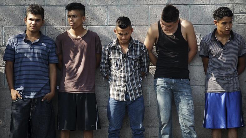 Suspected members of the Barrio 18 gang wait to be interrogated, San Salvador April 20, 2015.