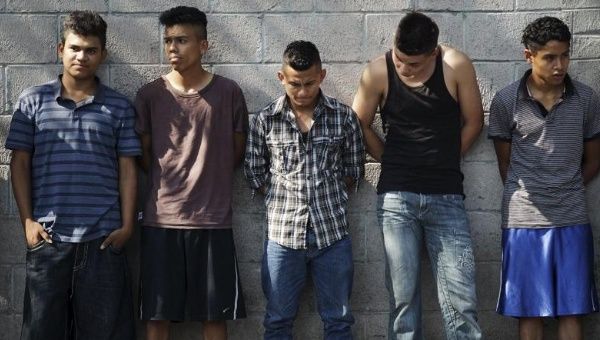 Suspected members of the Barrio 18 gang wait to be interrogated, San Salvador April 20, 2015.