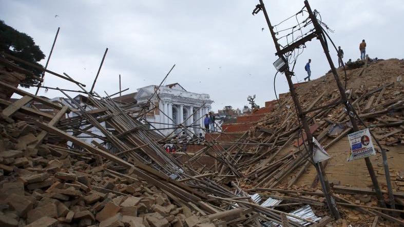 People work to rescue trapped people inside a temple in Bashantapur Durbar Square after an earthquake hit, in Kathmandu, Nepal April 25, 2015.