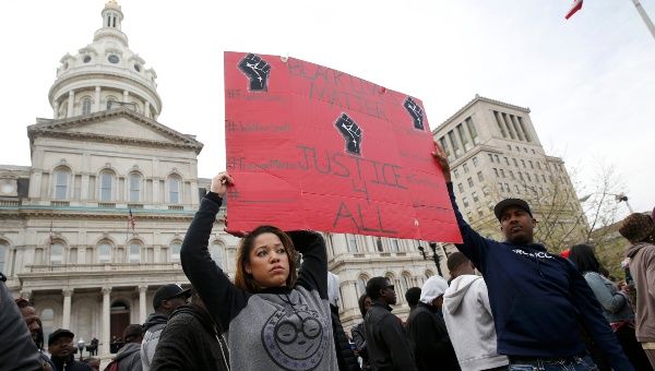 Protesters gather for a rally in Baltimore to protest the death of Freddie Gray, who died while in police custody.