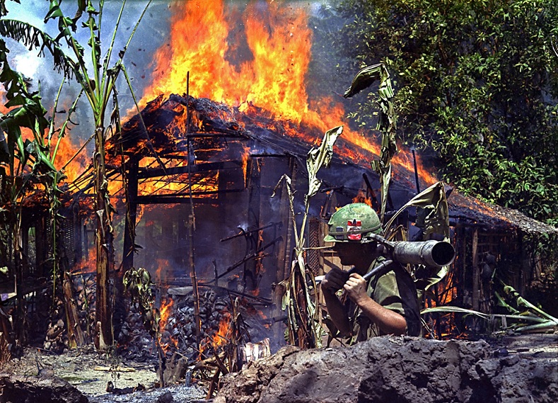 An alleged Vietcong camp is torched by U.S. soldiers.