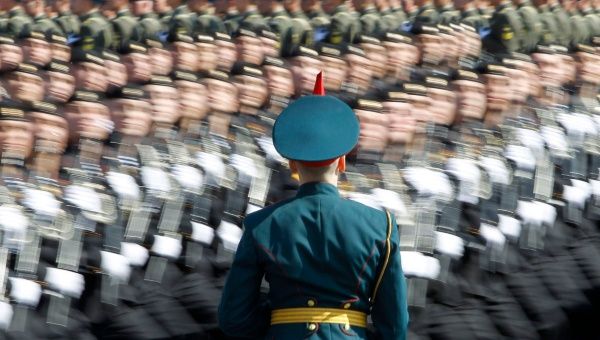 A Russian soldier stands at attention as troops march past during a rehearsal for the Victory Day parade at Moscow’s Red Square May 6, 2012. 