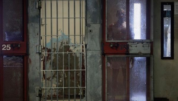 An inmate looks out from his cell in the Secure Housing Unit (SHU) at Corcoran State Prison in Corcoran, California Oct.1, 2013.