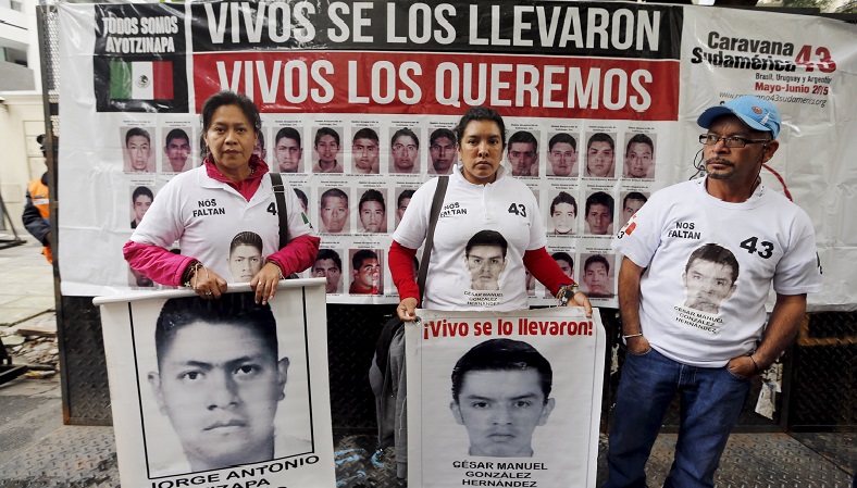 Thousands in Mexico City and gathered at the capital's main square to mark eight months since the Ayotzinapa students were forcibly disappeared.