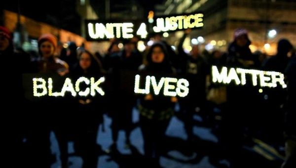 Demonstrators carry illuminated signs in a Black Lives Matter march in December 2014 in New York. 