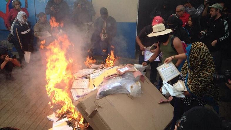 Demonstrators in the town of Tixtla, Guerrero burn electoral materials in an act of protest against elections they consider to be a farce, June 7, 2015.