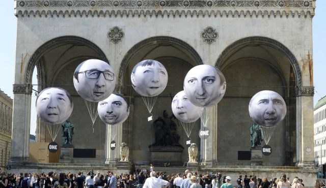 Activists installed balloons in Munich with the faces of G7 leaders.