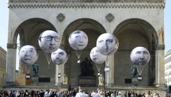 Activists installed balloons in Munich with the faces of G7 leaders.