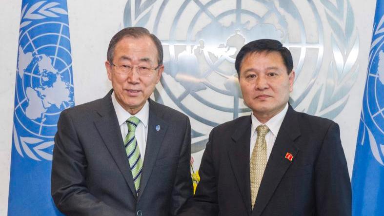 UN Secretary-General Ban Ki-moon (L) greets North Korea's new ambassador to the United Nations, Ja Song Nam, at the United Nations headquarters in New York, February 28, 2014.