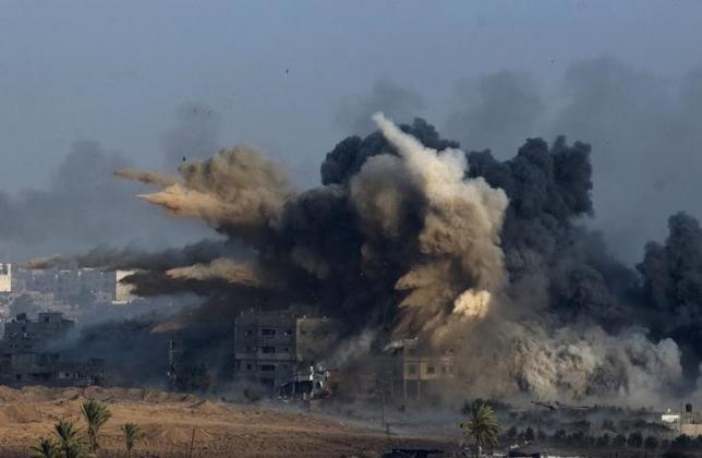 An explosion during an Israeli strike in the northern Gaza Strip in the early morning of July 26, 2014.