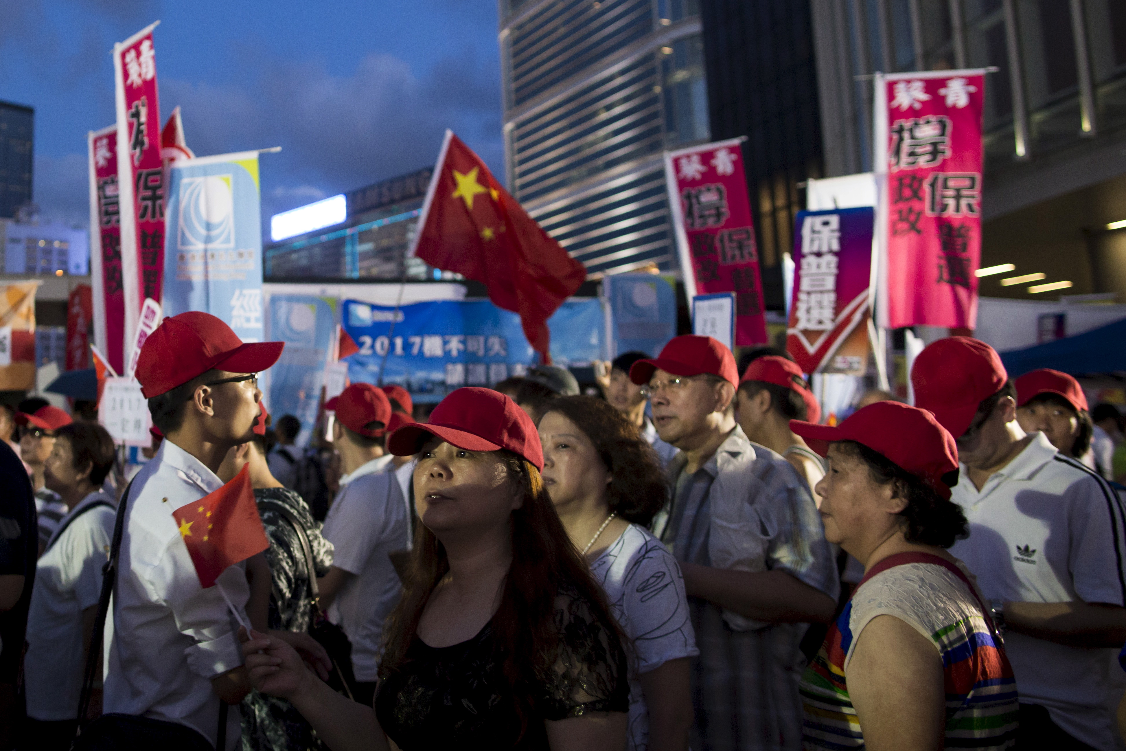 Pro-Beijing supporters appeared dismayed when the result was announced.