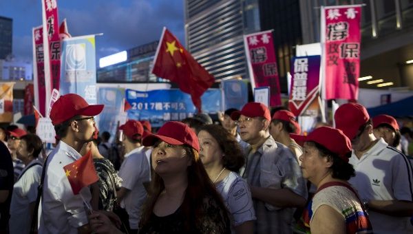 Pro-Beijing supporters appeared dismayed when the result was announced.