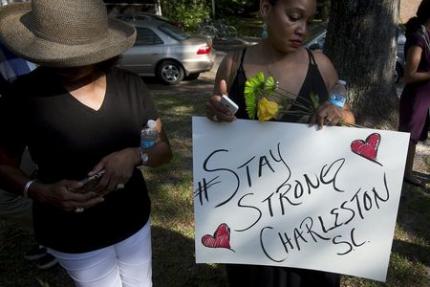 People take part in a Black Lives Matter march around Emanuel African Methodist Episcopal Church in Charleston, June 20, 2015.