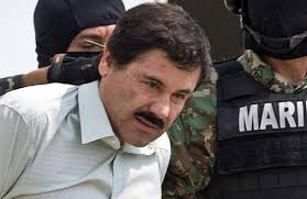 El Chapo Guzman escorted by soldiers after he was detained in February of 2014.