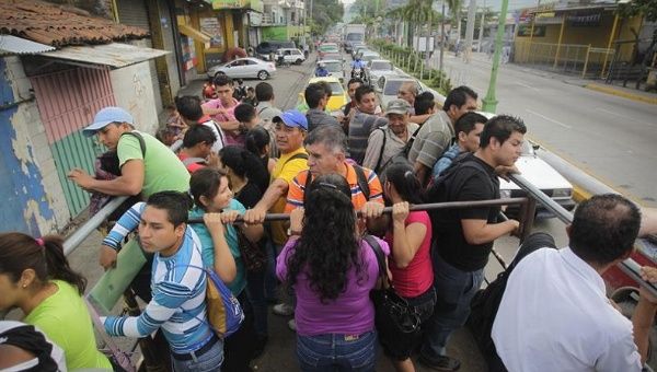 Dozens of Salvadorans travel by alternative means as transportation workers strike in San Salvador, July 28, 2015.