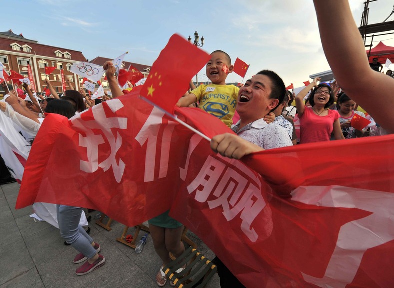 Chongli county residents celebrate in Zhangjiakou, Hebei province, which was chosen to co-host the games with capital Beijing, July 31, 2015.