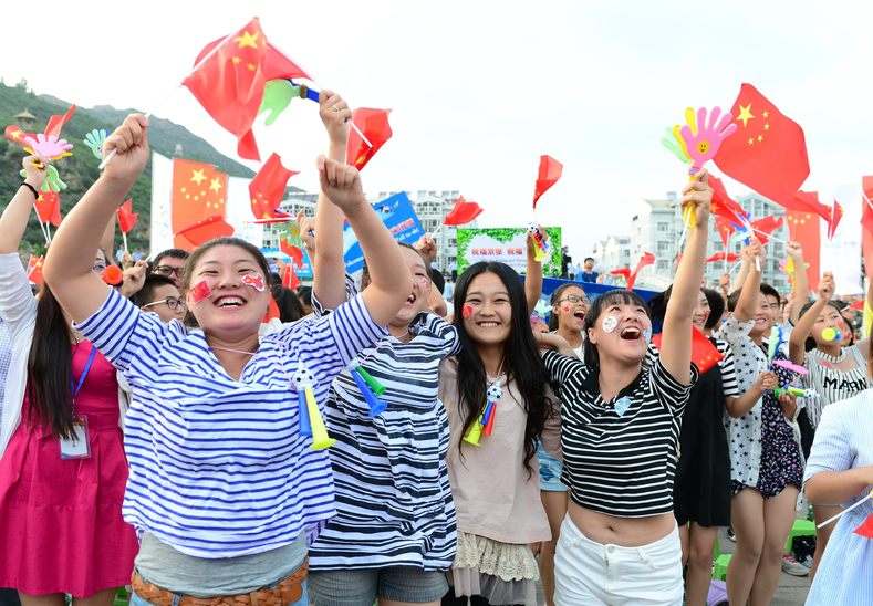 Chongli county residents celebrate in Zhangjiakou, Hebei province, which was chosen to co-host the games with capital Beijing, July 31, 2015.