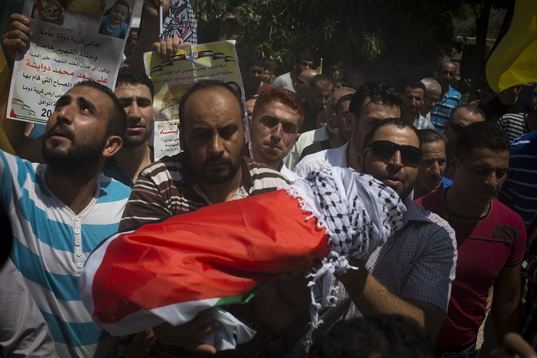 Relatives carry the body of 18-month-old Palestinian toddler Ali Saad Dawabsha, who died after his house was set on fire by Jewish settlers.