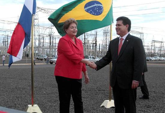 Brazilian and Paraguayan President's shake hands during as the two countries seek to resolve border incident.