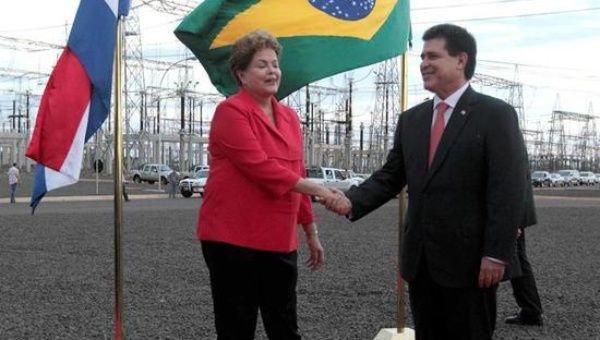 Brazilian and Paraguayan President's shake hands during as the two countries seek to resolve border incident. 