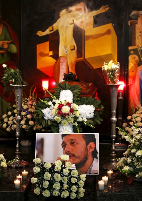 MEXICO CITY: A camera and a picture of photojournalist Ruben Espinosa are seen next to his coffin during the wake, August 2, 2015.