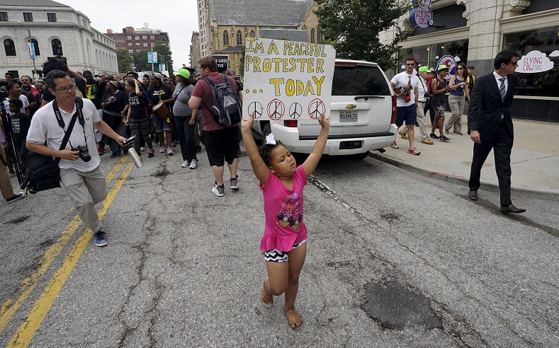 A young protester marches in downtown St. Louis August 10, 2015.