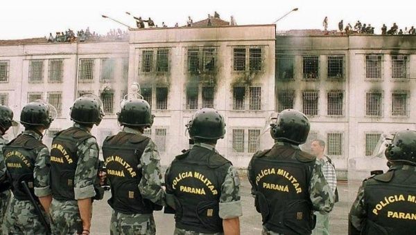 Police watch as inmates in a prison in the northeastern Brazilian state of Sergipe took control over the facility. 