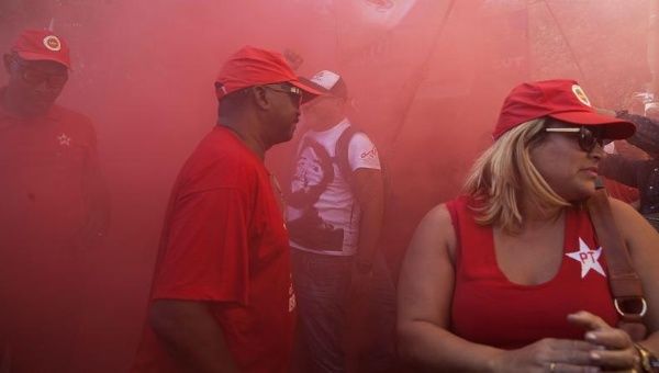 A group of demonstrators express support for former Brazilian president Luiz Inacio Lula da Silva during during an act against hatred and political intolerance, Aug. 7, 2015.