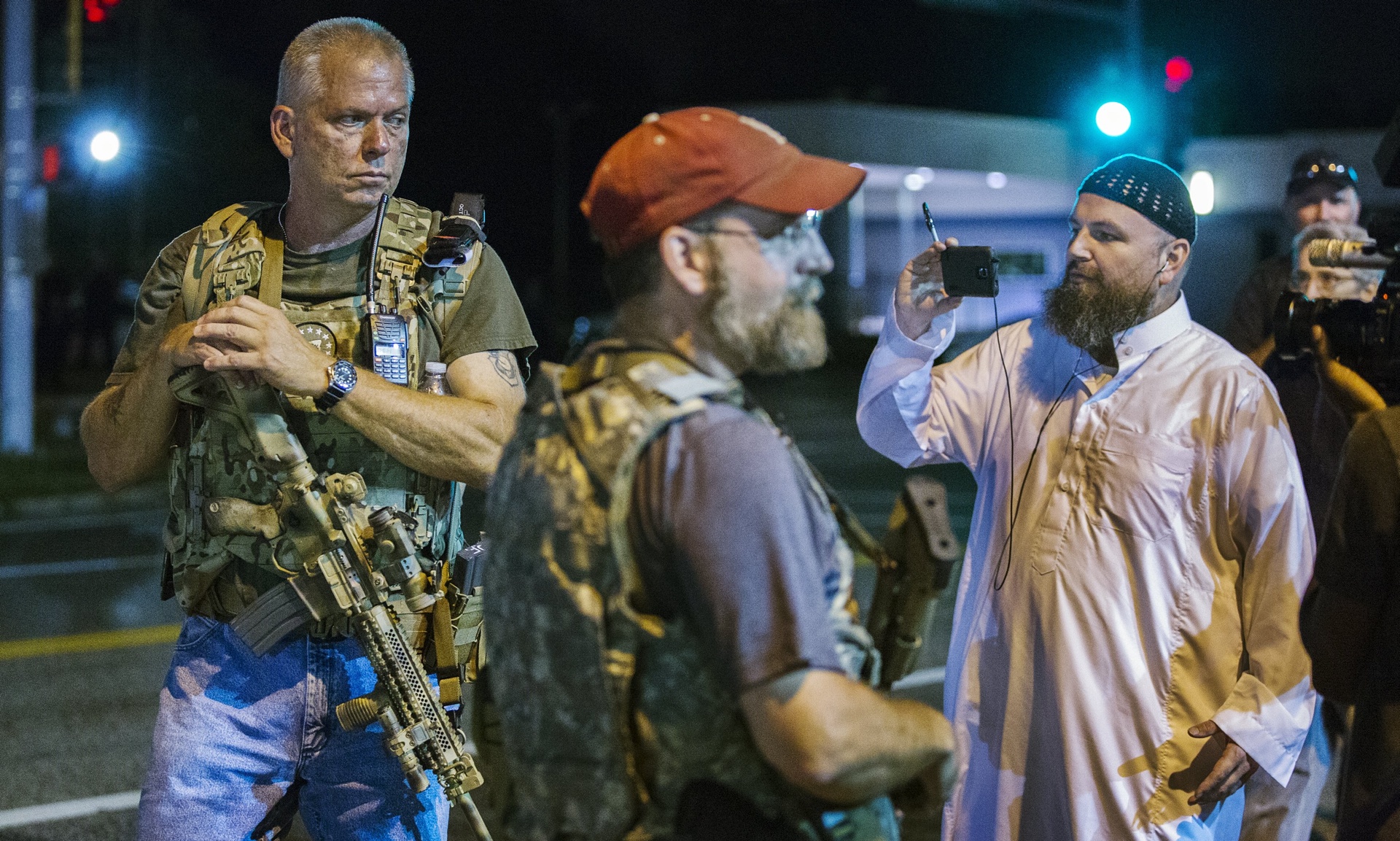 Heavily armed members of the Oath Keepers militia patrol the streets of Ferguson.