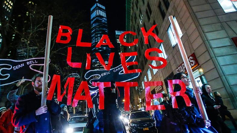 Protesters carry a sign at a Black Lives Matter rally in New York City.