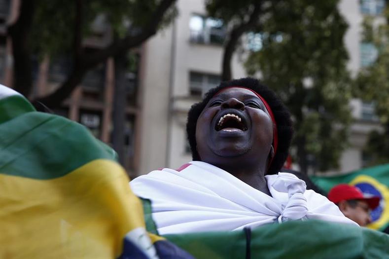 A woman marches in Rio de Janeiro, Brazil, in support of the Workers' Party president Dilma Rousseff on August 20, 2015.