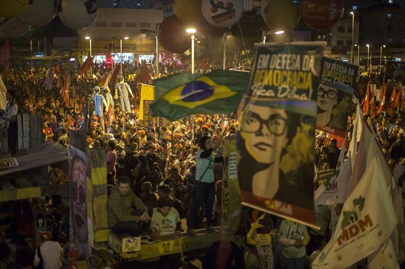 Members of social movements, unions, and left parties march in Sao Paulo, Brazil in support of President Dilma Rousseff on August 20, 2015. The upper-class opposition has been calling for Rousseff's impeachment. 