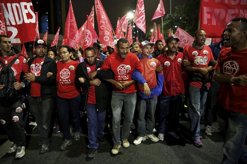 Members of Brazil's Homeless Workers' Movement march in support of president Dilma Rousseff in Sao Paulo, Brazil, on August 20, 2015.