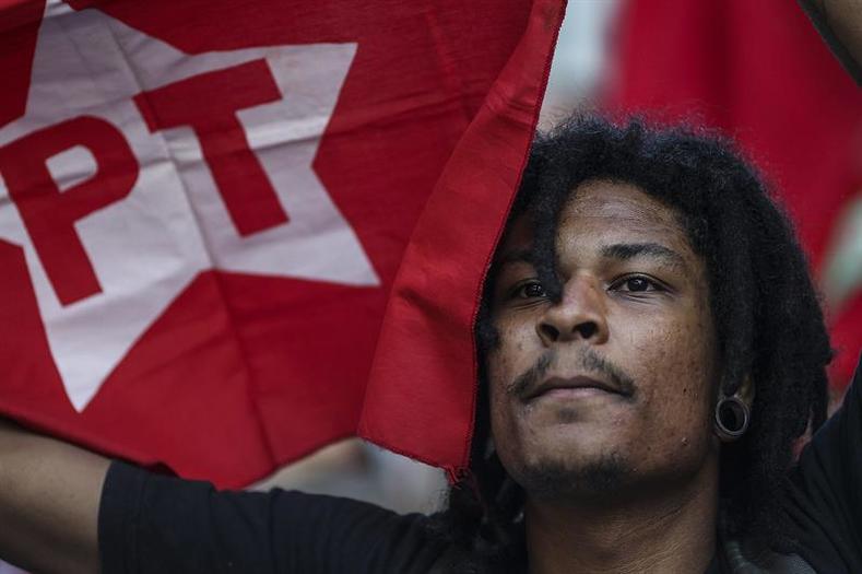 A man participates in a march in Sao Paulo, in favor of Brazil's Workers' Party (PT) and President Dilma Rousseff on August 20, 2015.