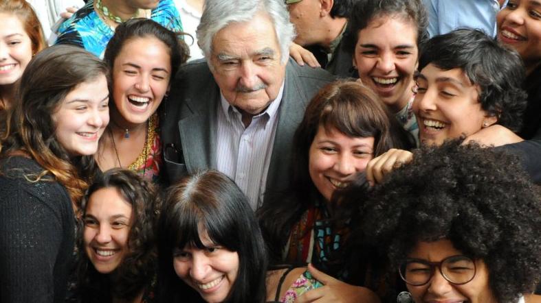 Jose Mujica is received by an overwhelming crowd of 5,000 students at State University of Rio de Janeiro
