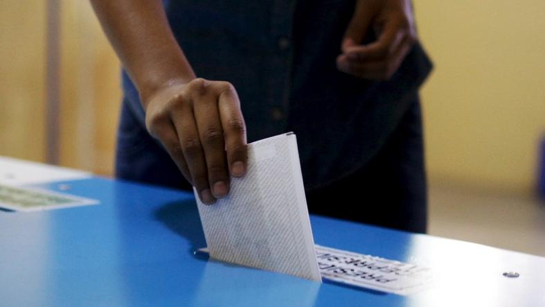 A man casts his vote at a polling station during general elections in Guatemala City, September 6, 2015.