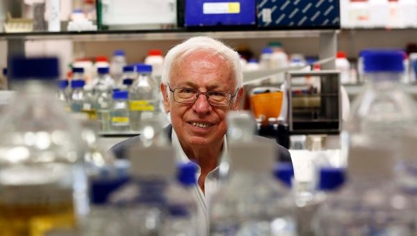 Tomas Lindahl poses for photographers after winning the Nobel Prize for Chemistry at the Francis Crick Institute Clare Hall Laboratory.