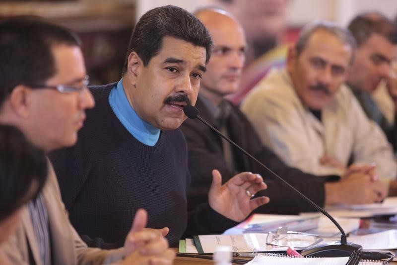 Venezuela's President Nicolas Maduro (2nd L) speaks during a meeting with ministers in this handout picture provided by Miraflores Palace on Sept. 30, 2015