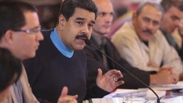 Venezuela's President Nicolas Maduro (2nd L) speaks during a meeting with ministers in this handout picture provided by Miraflores Palace on Sept. 30, 2015