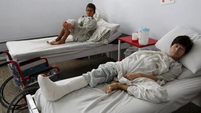 Wounded Afghan boys, who survived a U.S. air strike on a Medecins Sans Frontieres (MSF) hospital in Kunduz, receive treatment.